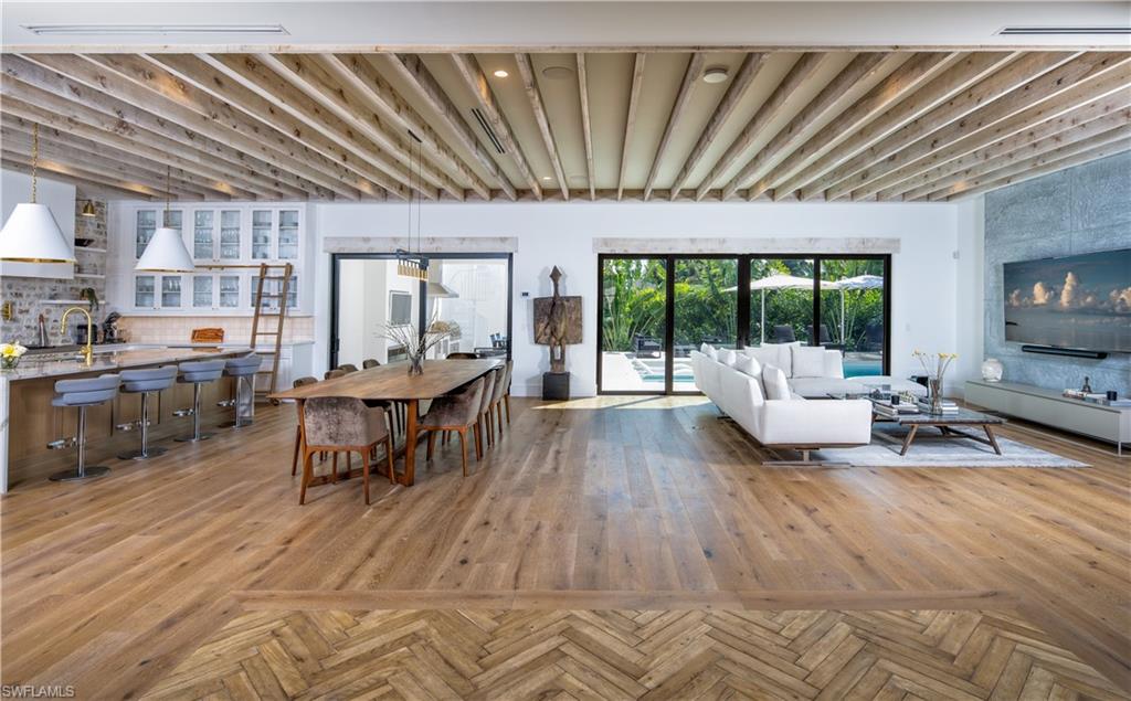 3770 Crayton Road Naples, FL 34103 - Photo 2 of 26 a living room with furniture and a flat screen tv