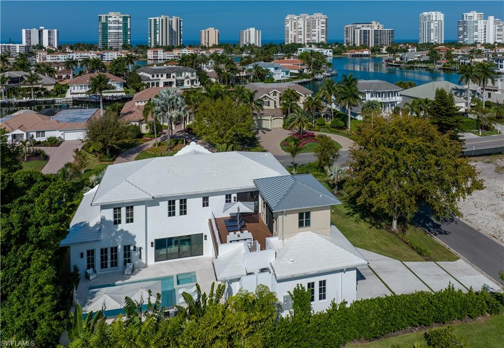 3770 Crayton Road Naples, FL 34103 - Photo 22 of 26 an aerial view of multiple houses
