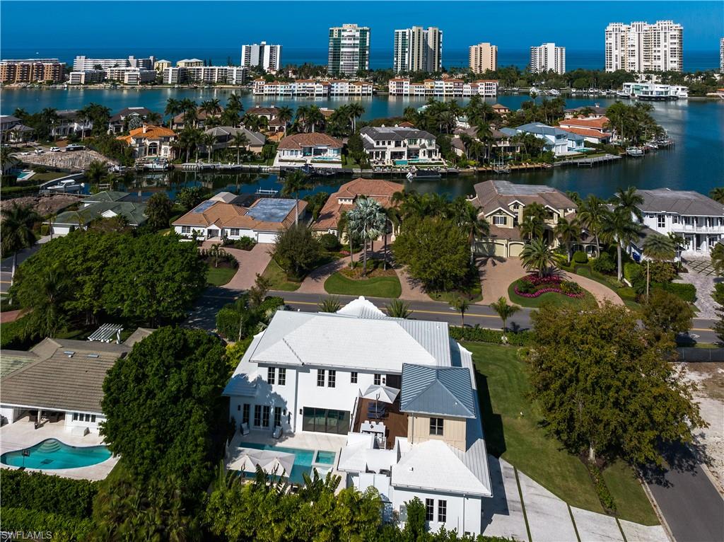 3770 Crayton Road Naples, FL 34103 - Photo 25 of 26 an aerial view of a house with a lake view