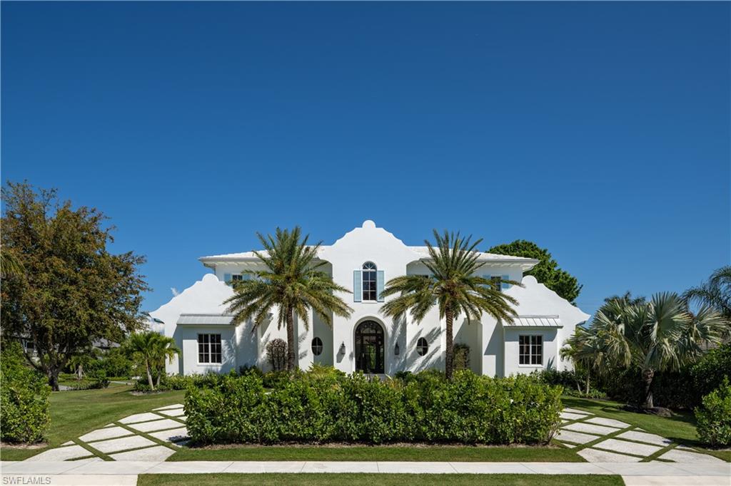 3770 Crayton Road Naples, FL 34103 - Photo 26 of 26 a front view of a house with a yard