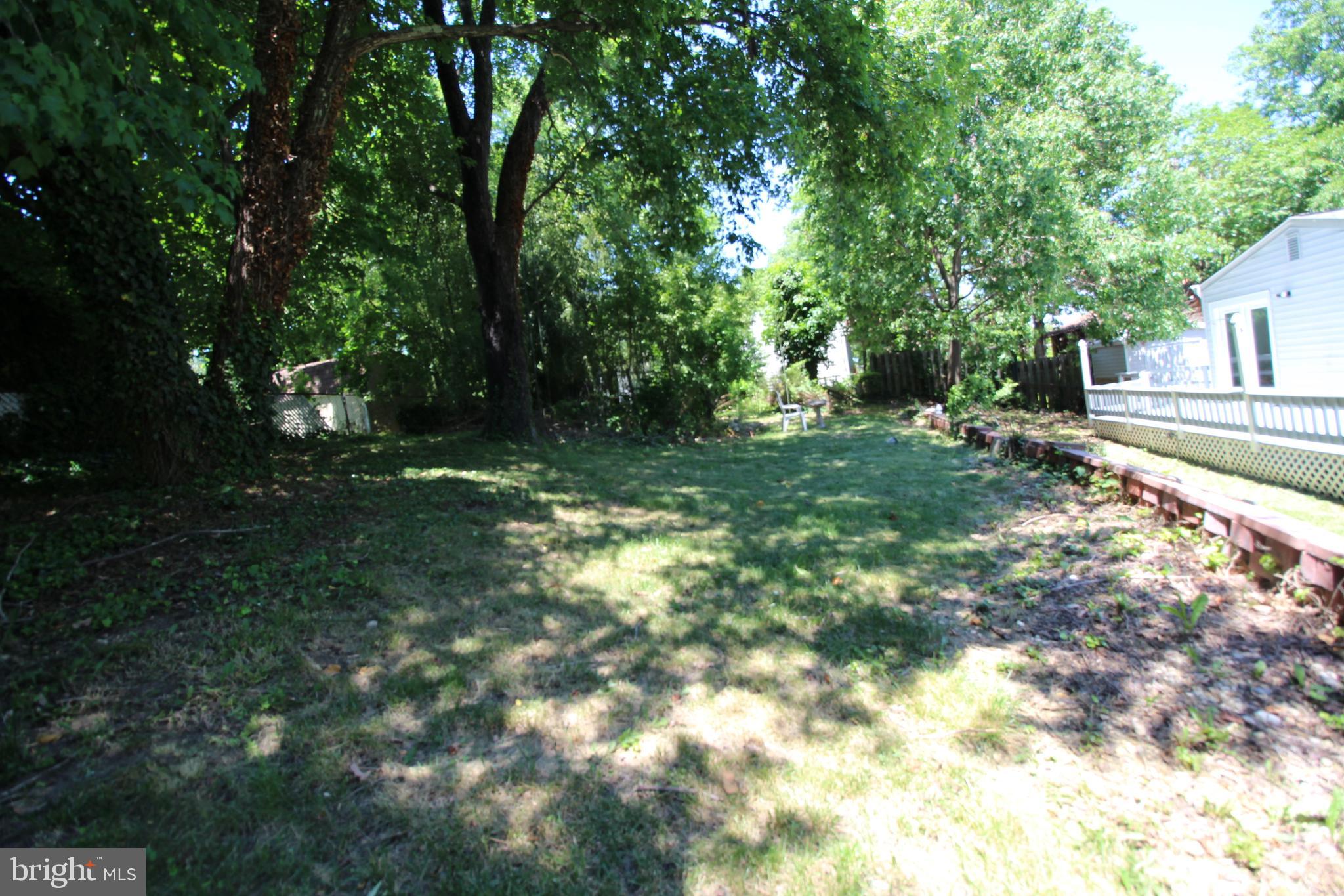 9003 Anna Drive Clinton, MD 20735 - Photo 12 of 41 a backyard of a house with lots of green space
