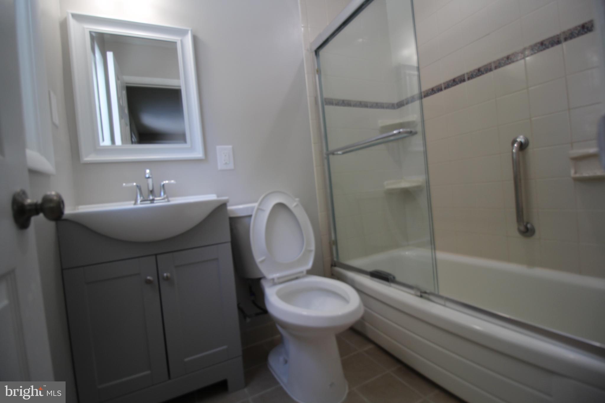 9003 Anna Drive Clinton, MD 20735 - Photo 21 of 41 a bathroom with a sink toilet and shower