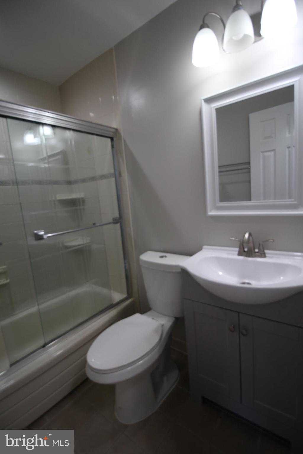 9003 Anna Drive Clinton, MD 20735 - Photo 24 of 41 a bathroom with a sink a toilet and shower
