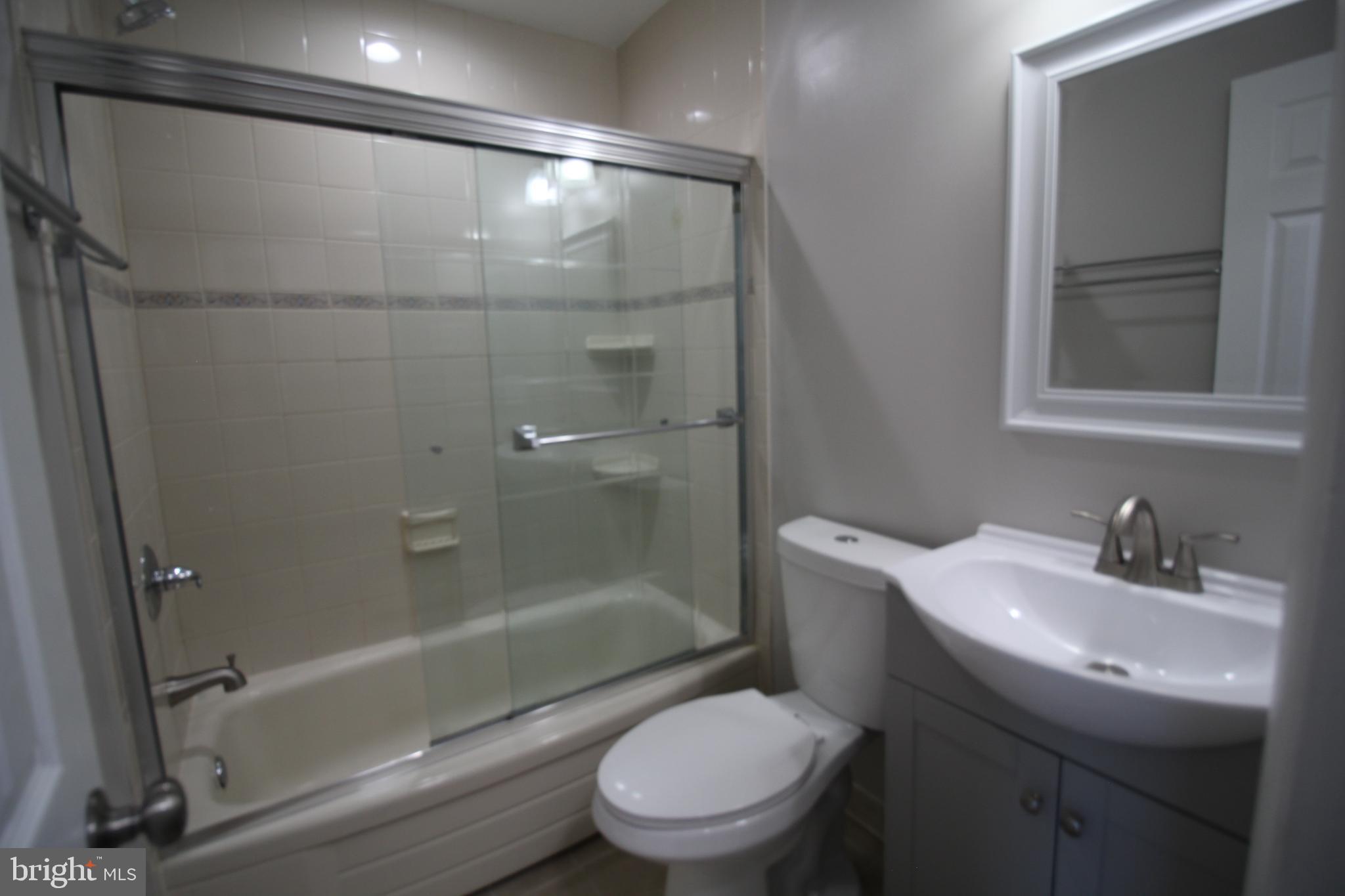 9003 Anna Drive Clinton, MD 20735 - Photo 25 of 41 a bathroom with a sink toilet and shower
