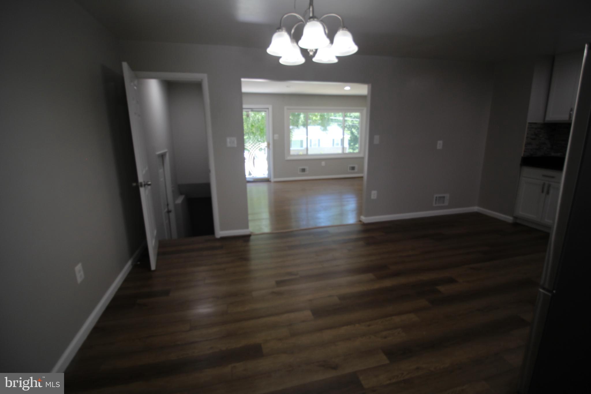 9003 Anna Drive Clinton, MD 20735 - Photo 27 of 41 wooden floor in an empty room with a window