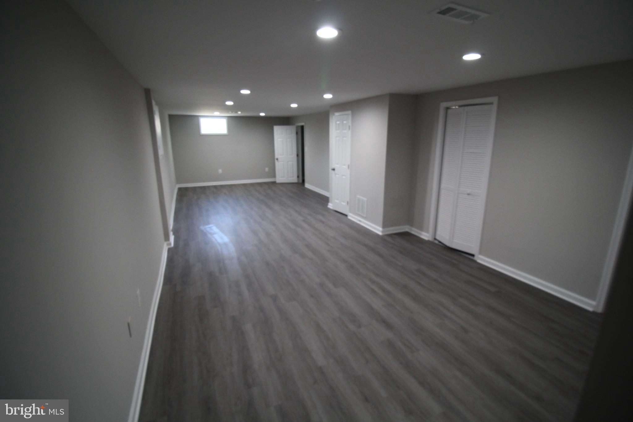 9003 Anna Drive Clinton, MD 20735 - Photo 33 of 41 a view of hallway with wooden floor