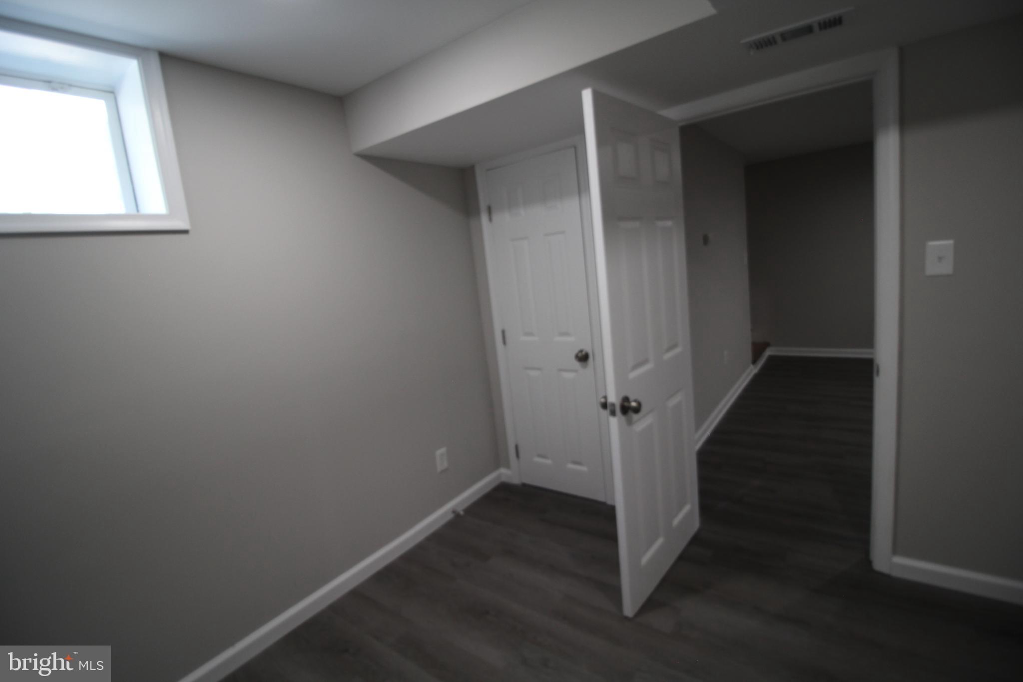 9003 Anna Drive Clinton, MD 20735 - Photo 35 of 41 an empty room with wooden floor closet and windows