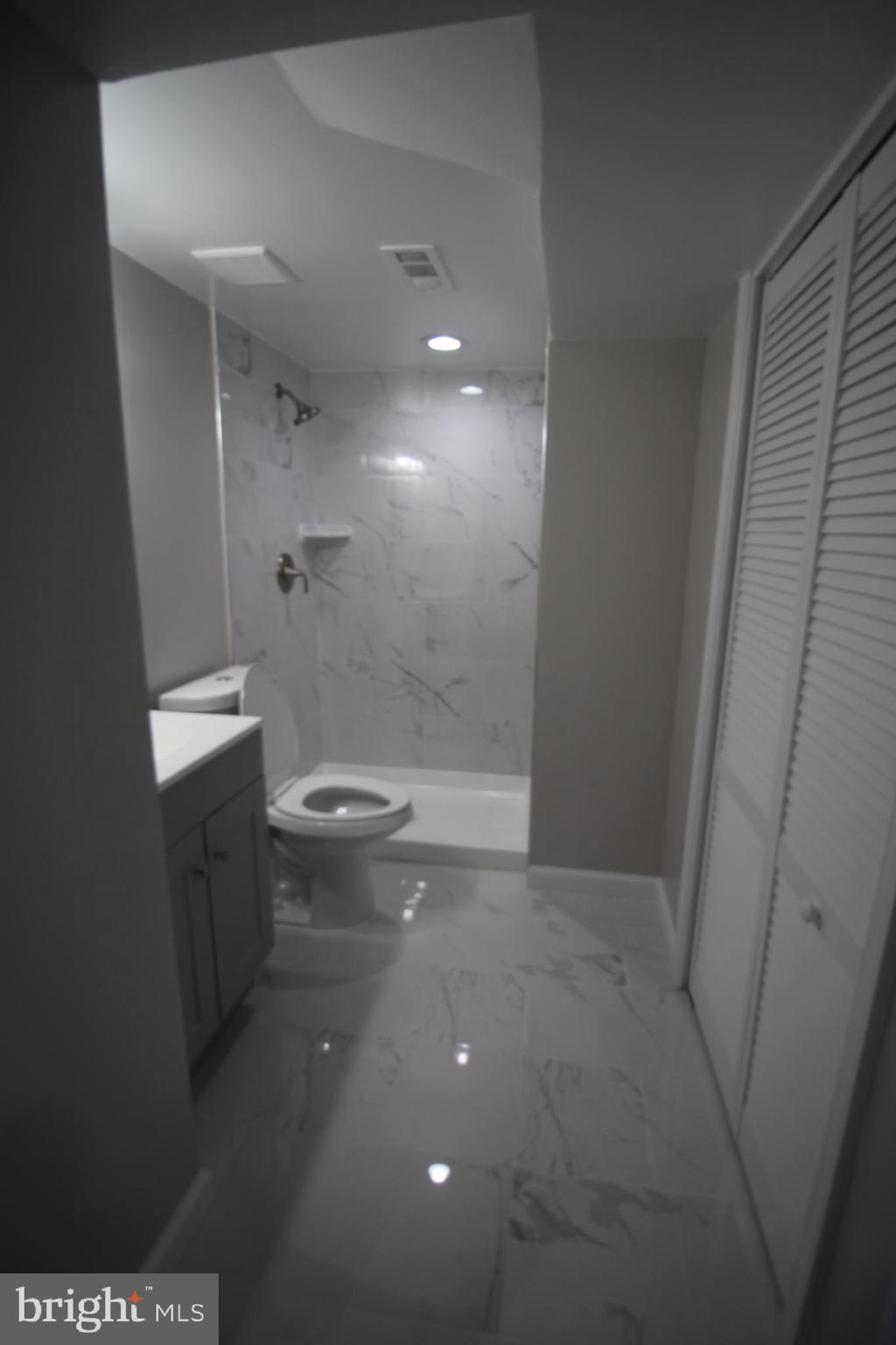 9003 Anna Drive Clinton, MD 20735 - Photo 39 of 41 a bathroom with a toilet and a shower