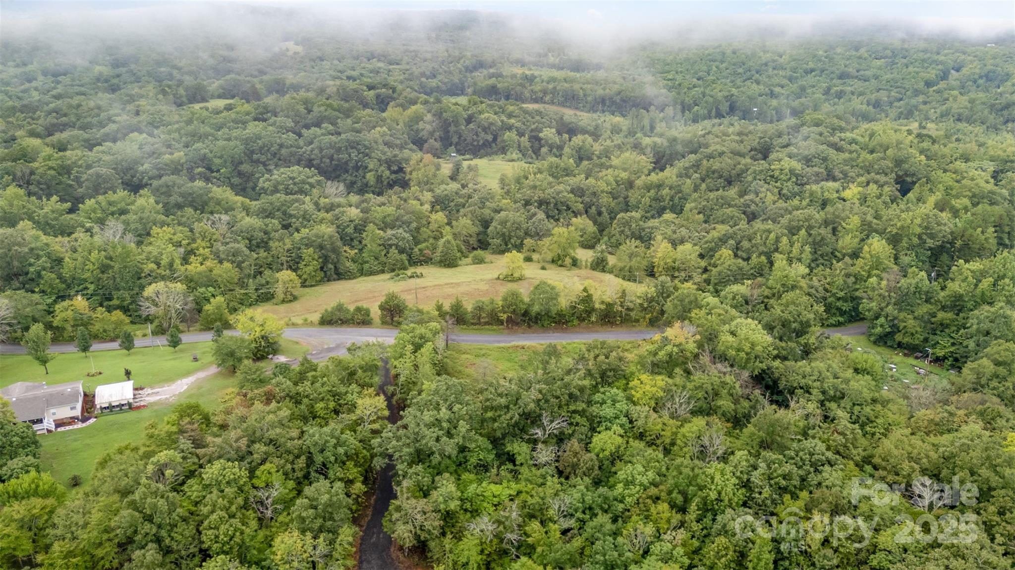 1554 Mason Montgomery Road Clover, SC 29710 - Photo 13 of 19 a view of a field of grass and trees