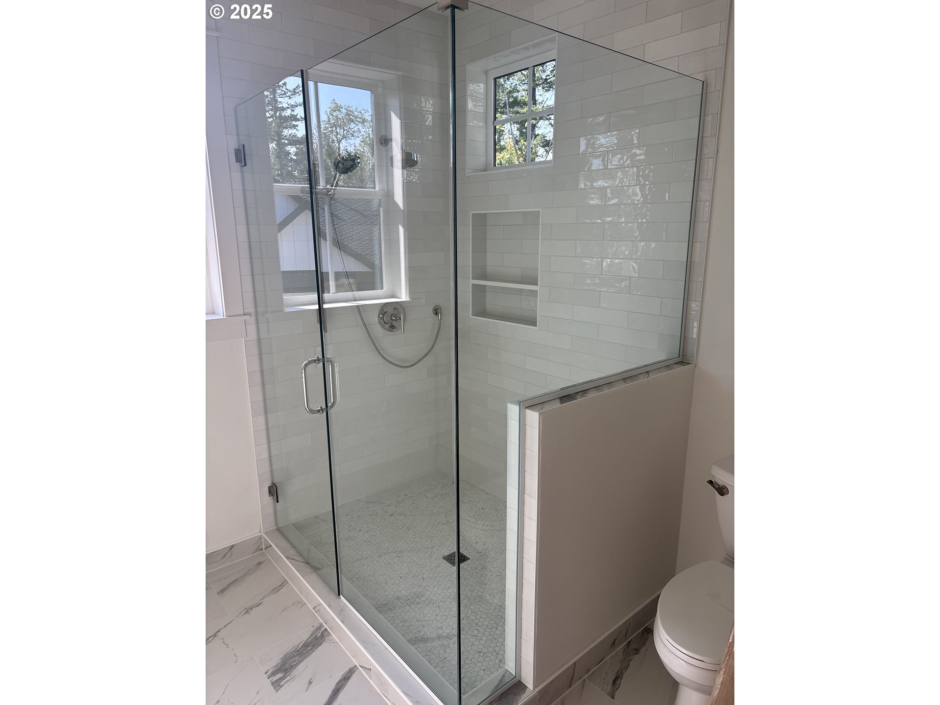 9999 Southwest Taylor Street Portland, OR 97225 - Photo 17 of 32 a bathroom with a glass shower door