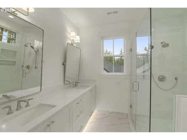 a bathroom with a toilet a sink and a window