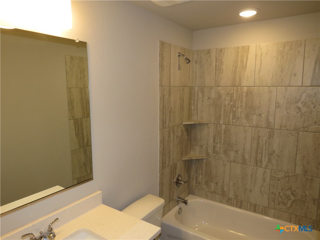 5737 Redfish Court Belton, TX 76513 - Photo 18 of 20 a bathroom with a sink and a bathtub