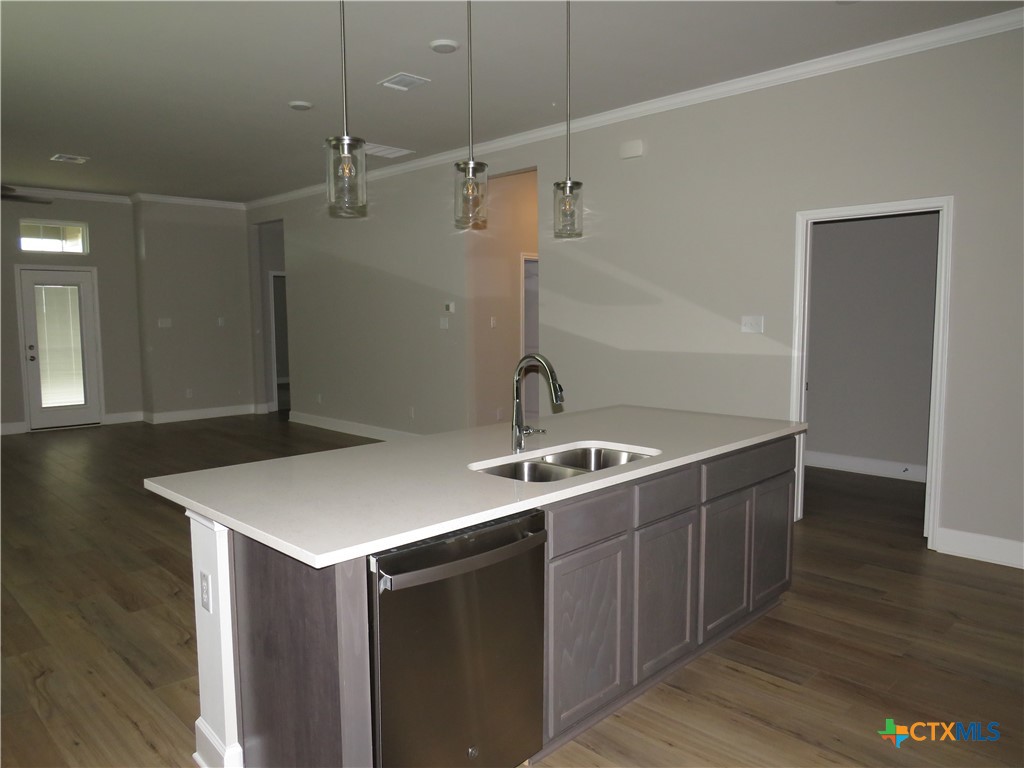 5737 Redfish Court Belton, TX 76513 - Photo 8 of 20 a room with a sink cabinets and wooden floor