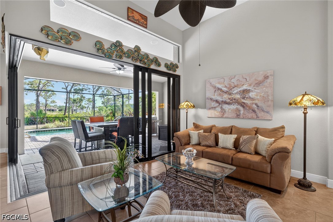 6109 Calusa Rdg Trail Bokeelia, FL 33922 - Photo 10 of 48 a living room with furniture and a large window