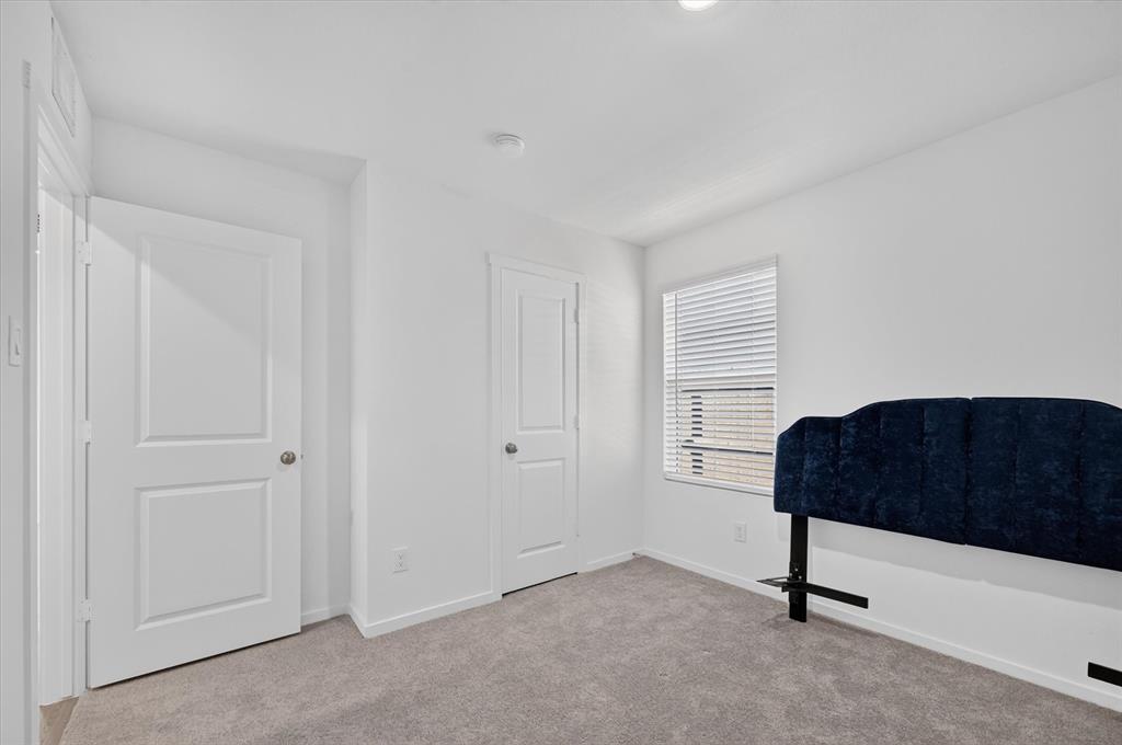 1260 Balsam Road Wilmer, TX 75172 - Photo 12 of 20 Carpeted room with a window featuring horizontal blinds