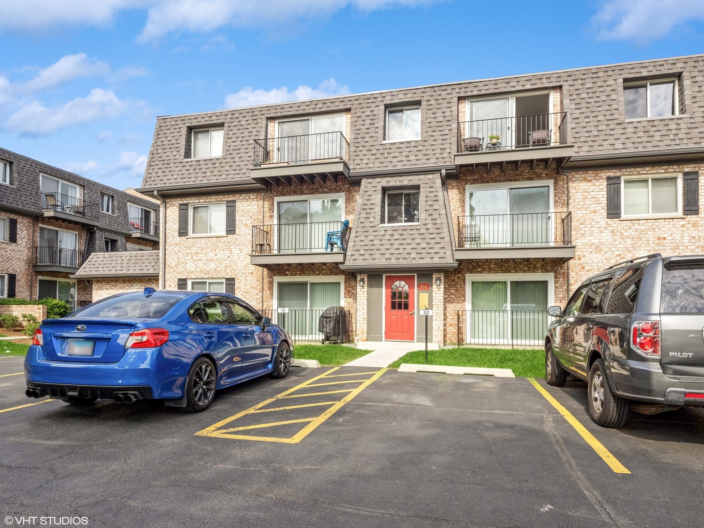 904 South Plum Grove Road, Unit 202 Palatine, IL 60067 - Photo 1 of 14 a car parked in front of a house