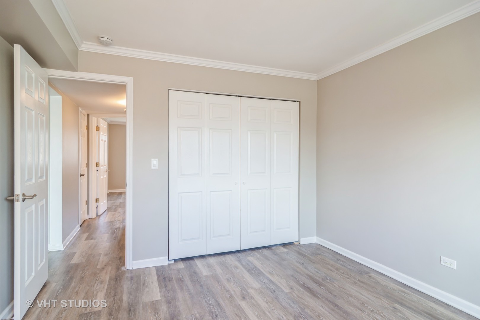 904 South Plum Grove Road, Unit 202 Palatine, IL 60067 - Photo 11 of 14 wooden floor in a hallway