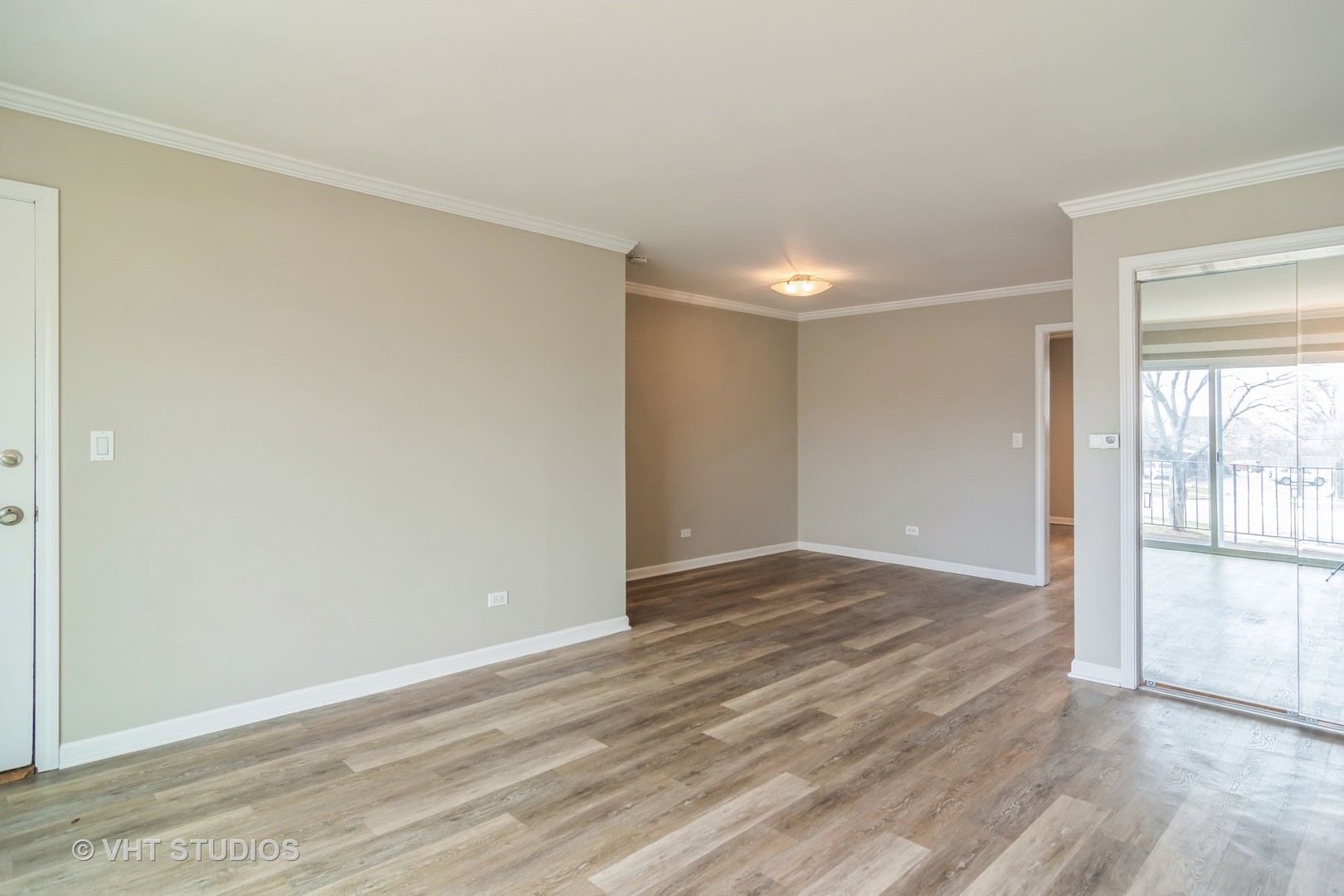 904 South Plum Grove Road, Unit 202 Palatine, IL 60067 - Photo 4 of 14 a view of an empty room and window