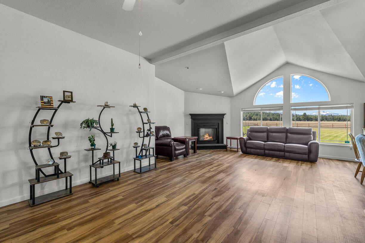 67500 Harrington Loop Road Bend, OR 97703 - Photo 9 of 72 a living room with furniture and a fireplace