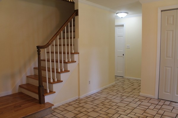 23 West Colonial Road Wilbraham, MA 01095 - Photo 11 of 30 a view of entryway with wooden floor and stairs