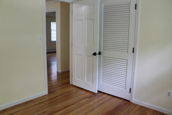 23 West Colonial Road Wilbraham, MA 01095 - Photo 18 of 30 an empty room with wooden floor and closet