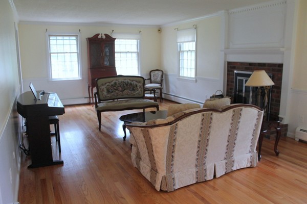 23 West Colonial Road Wilbraham, MA 01095 - Photo 2 of 30 a living room with furniture and wooden floor