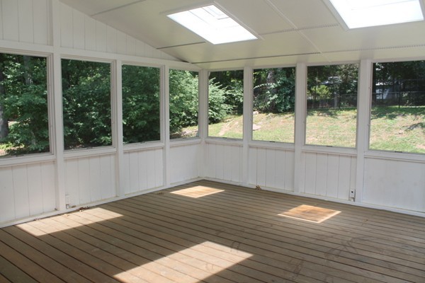 23 West Colonial Road Wilbraham, MA 01095 - Photo 24 of 30 a view of an empty room with wooden floor and a window