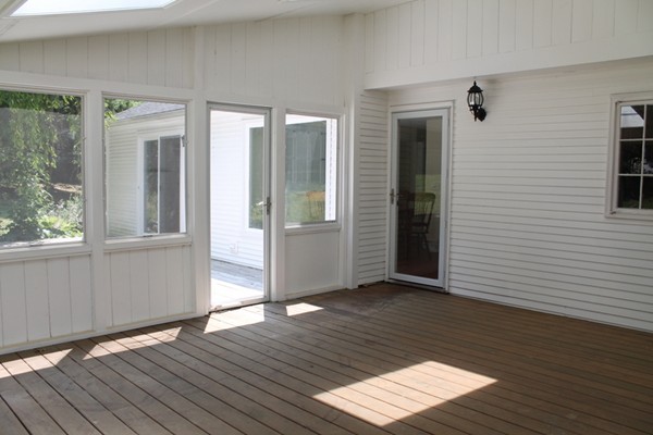 23 West Colonial Road Wilbraham, MA 01095 - Photo 25 of 30 a view of an empty room with wooden floor and a window