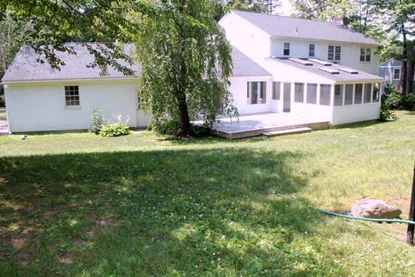 23 West Colonial Road Wilbraham, MA 01095 - Photo 30 of 30 a view of a house with a backyard and a tree