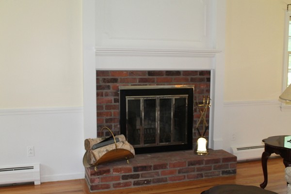 23 West Colonial Road Wilbraham, MA 01095 - Photo 4 of 30 a living room with furniture and a fireplace