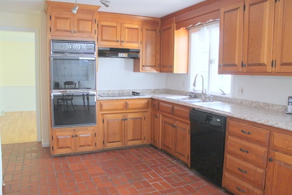 23 West Colonial Road Wilbraham, MA 01095 - Photo 6 of 30 a kitchen with stainless steel appliances granite countertop a sink stove and cabinets