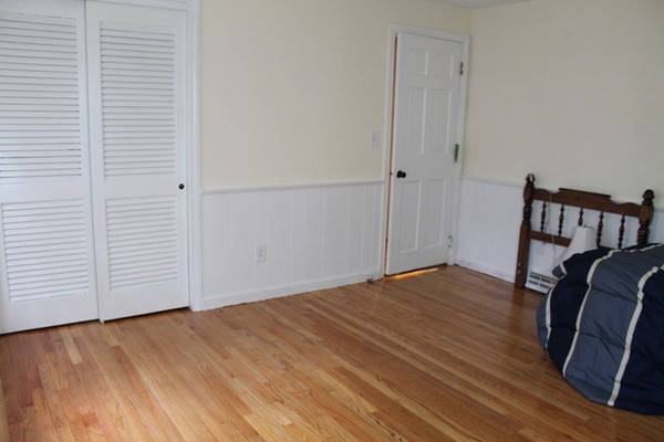 23 West Colonial Road Wilbraham, MA 01095 - Photo 9 of 30 a view of room with wooden floor and chair