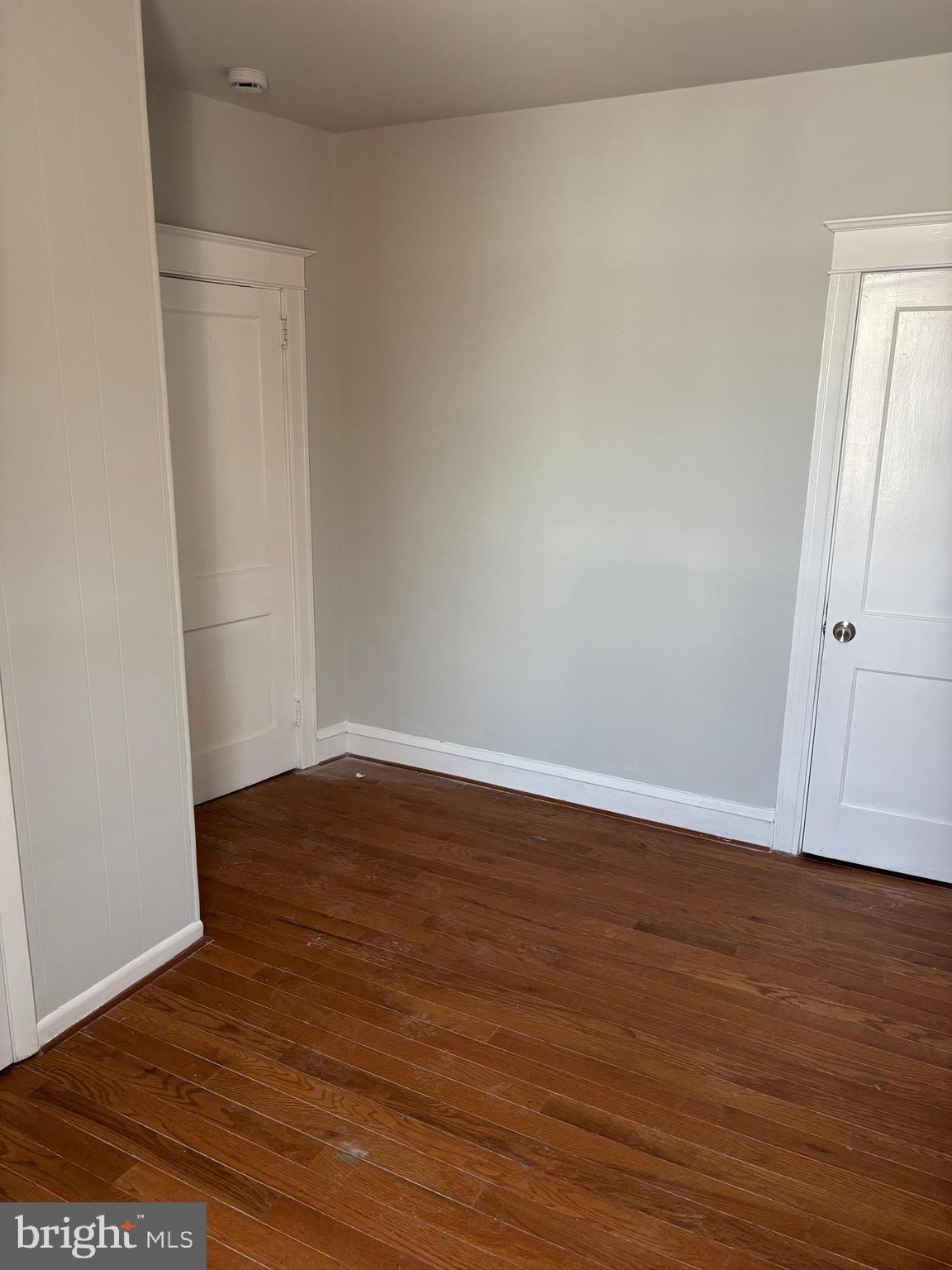 227 Wembly Road Upper Darby, PA 19082 - Photo 15 of 19 a view of an empty room with wooden floor