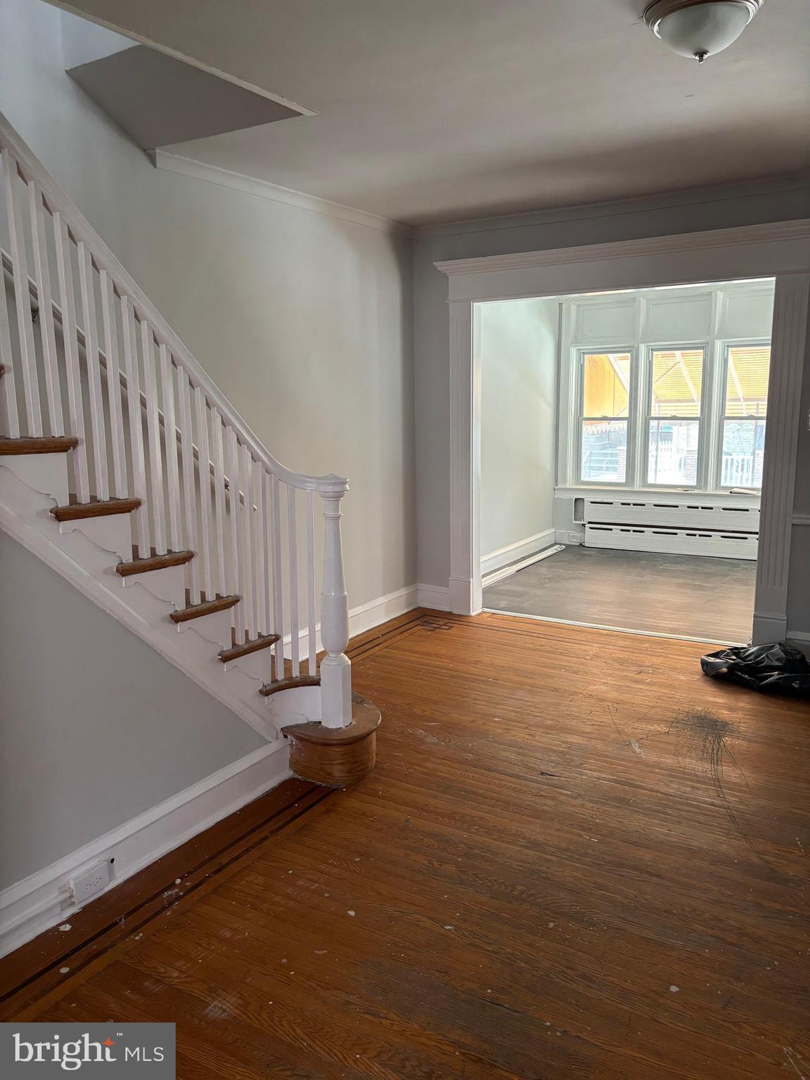 227 Wembly Road Upper Darby, PA 19082 - Photo 6 of 19 a view of an empty room with stairs