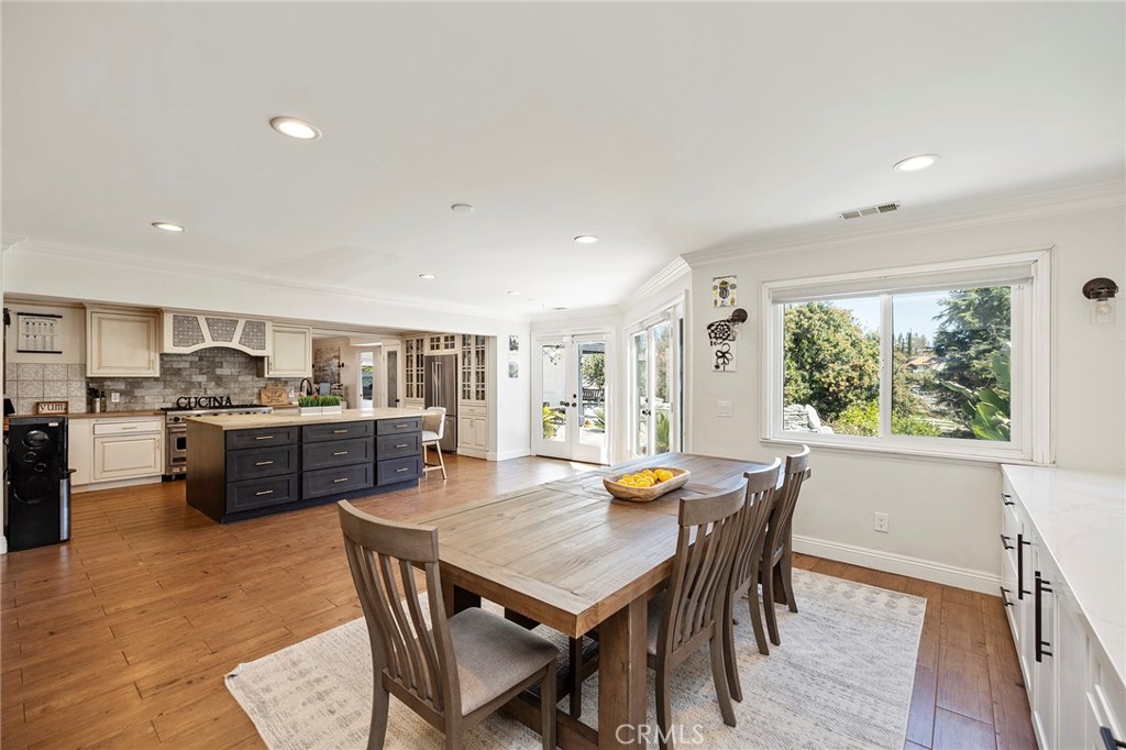41480 Luz Del Sol Temecula, CA 92591 - Photo 14 of 44 a view of a dining room with furniture and wooden floor