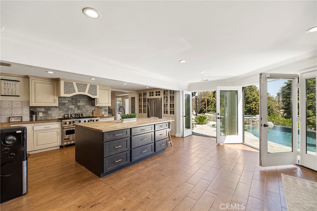 41480 Luz Del Sol Temecula, CA 92591 - Photo 17 of 44 a large kitchen with kitchen island a large counter top space and stainless steel appliances