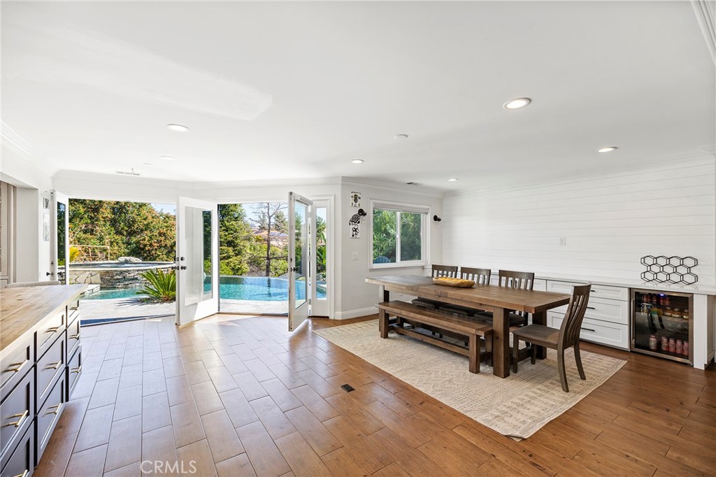 41480 Luz Del Sol Temecula, CA 92591 - Photo 20 of 44 a living room with furniture a large window and wooden floor
