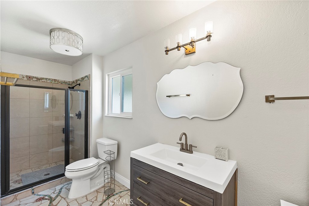 41480 Luz Del Sol Temecula, CA 92591 - Photo 26 of 44 a bathroom with a sink a toilet and shower