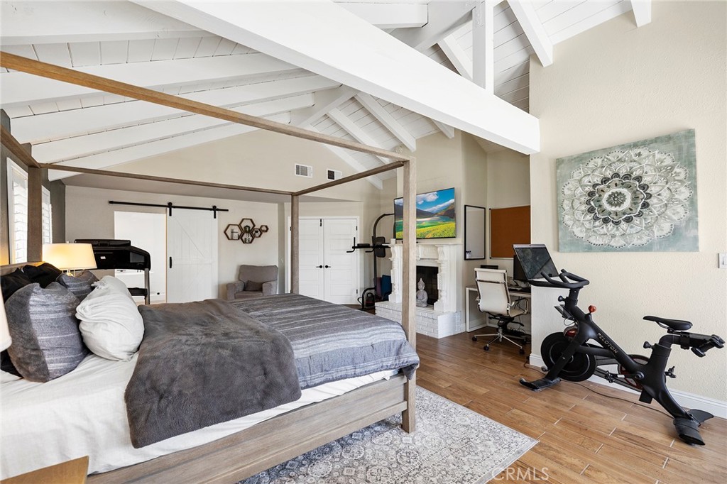 41480 Luz Del Sol Temecula, CA 92591 - Photo 29 of 44 a bedroom with a bed gym equipment and view of living room