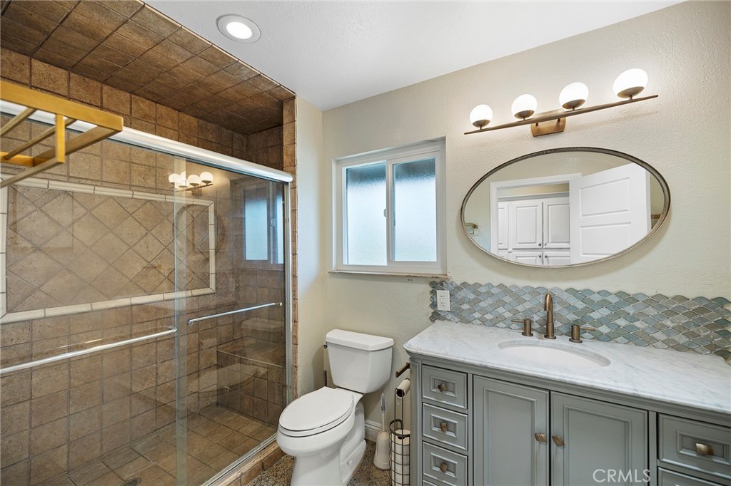 41480 Luz Del Sol Temecula, CA 92591 - Photo 36 of 44 a bathroom with a sink a toilet and a mirror