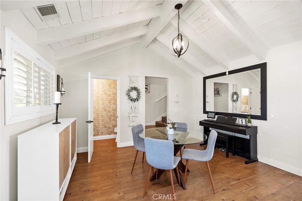 41480 Luz Del Sol Temecula, CA 92591 - Photo 5 of 44 a view of a dining room with furniture window and wooden floor