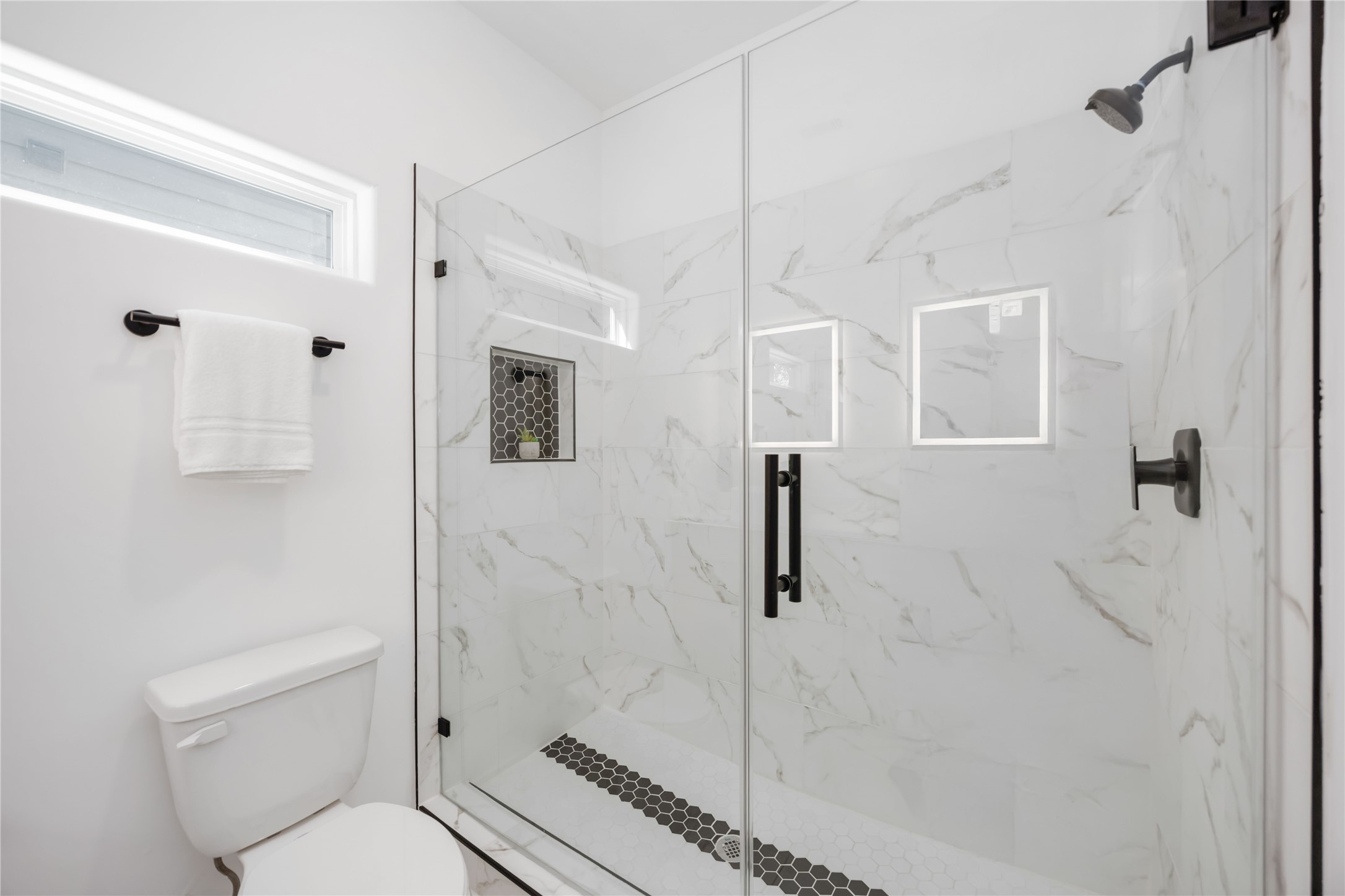 5811 Senior Street, Unit A Houston, TX 77016 - Photo 9 of 15 a bathroom with a toilet a sink and shower