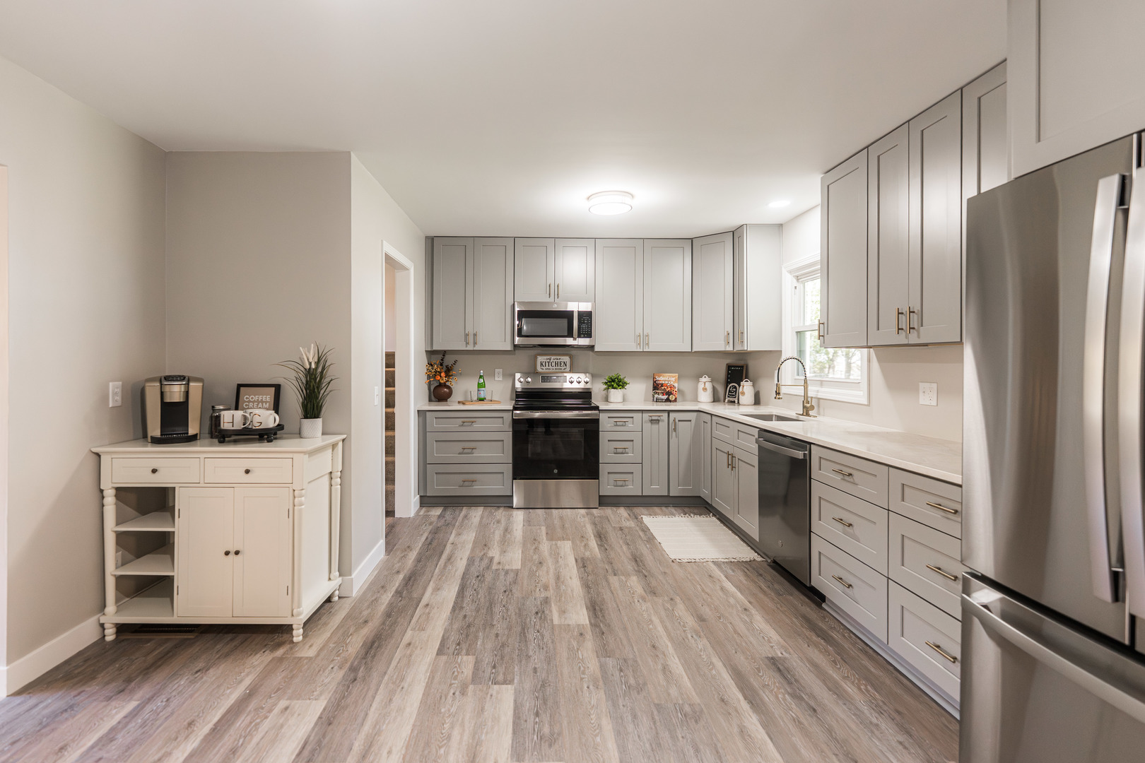 21044 Virginia Road DeKalb, IL 60115 - Photo 11 of 58 a large kitchen with cabinets stainless steel appliances a sink and a center island