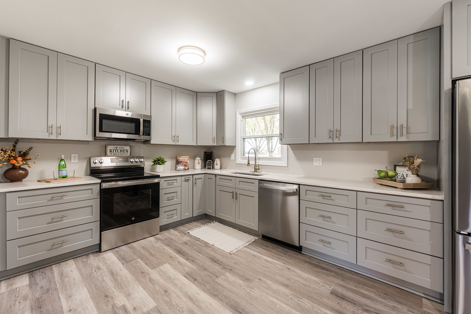 21044 Virginia Road DeKalb, IL 60115 - Photo 21 of 58 a kitchen with granite countertop cabinets and steel stainless steel appliances