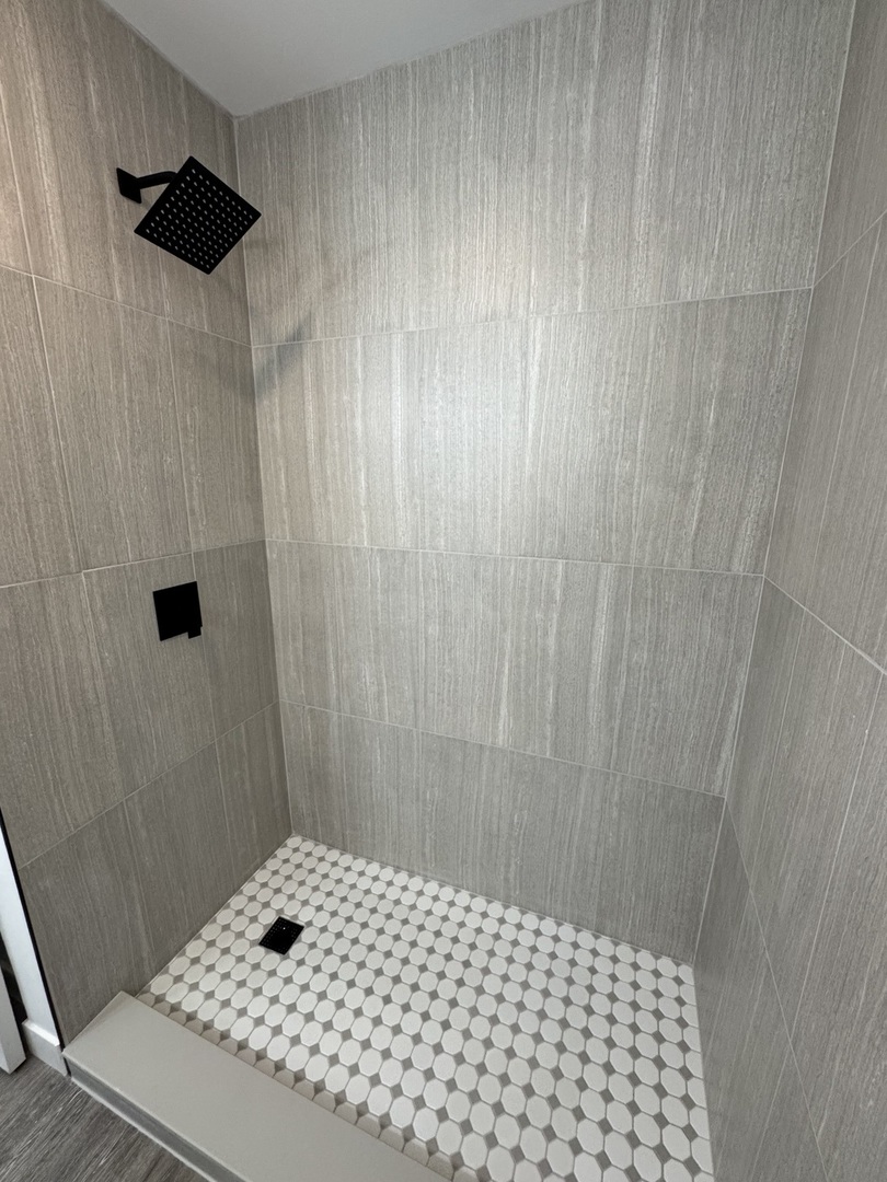 21044 Virginia Road DeKalb, IL 60115 - Photo 29 of 58 a bathroom with a sink and a shower