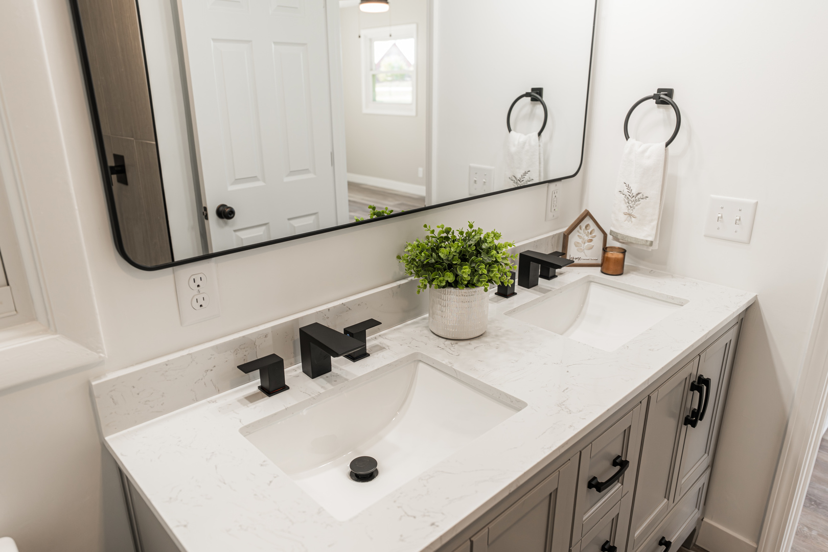 21044 Virginia Road DeKalb, IL 60115 - Photo 32 of 58 a bathroom with a sink and a mirror