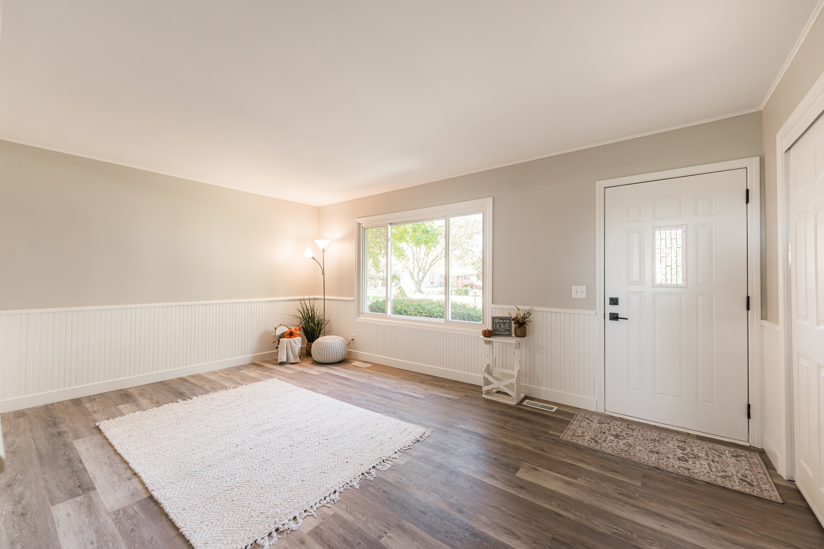 21044 Virginia Road DeKalb, IL 60115 - Photo 7 of 58 a bedroom with a bed and wooden floor