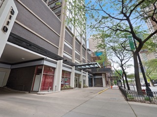 3110 North Sheridan Road, Unit 904 Chicago, IL 60657 - Photo 1 of 12 a view of a building with a tree