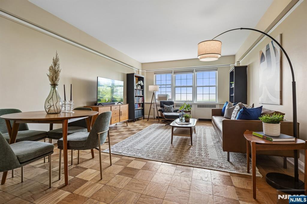 10 Crestmont Road, Unit 5J Montclair, NJ 07042 - Photo 2 of 21 a living room with furniture a window and a table