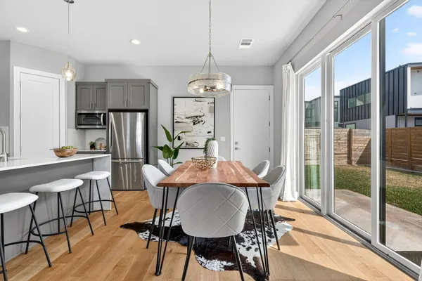 a view of a dining room with furniture window and outside view
